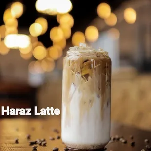 a glass of coffee on a table