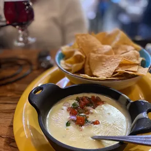 a bowl of soup and chips