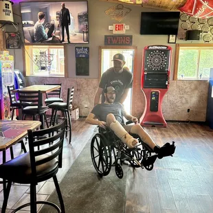a man in a wheelchair and a woman in a wheelchair