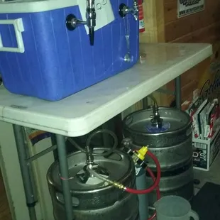 a beer cooler and kegs