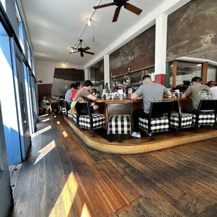 people sitting at a table in a restaurant