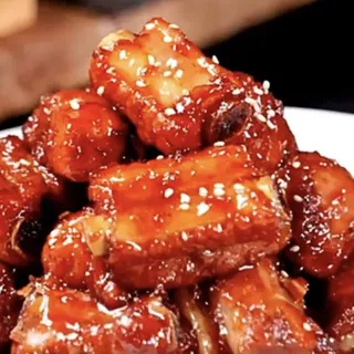 97. Spareribs W/ Sweet & Sour Sauce 97.