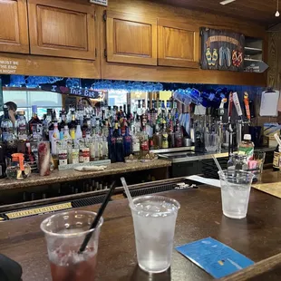Bar view. Mirror shows reflection of lake and boats.