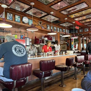 customers sitting at the bar