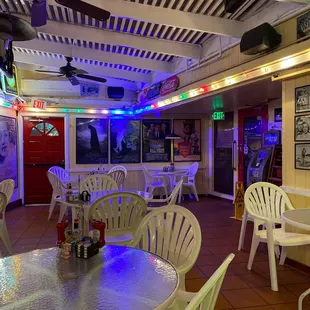 tables, chairs, and a ceiling fan