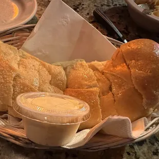 a basket of bread and dips