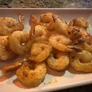 a plate of cooked shrimp