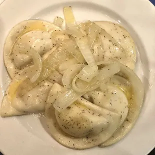 Perogies- boiled covered in butter and topped with onions. So good