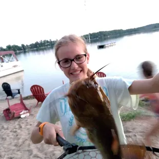 My girl caught the biggest bullhead she's ever seen right off Harbor Lights' dock!