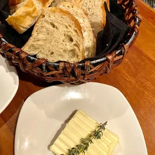 Warm fresh sourdough bread and chilled butter.