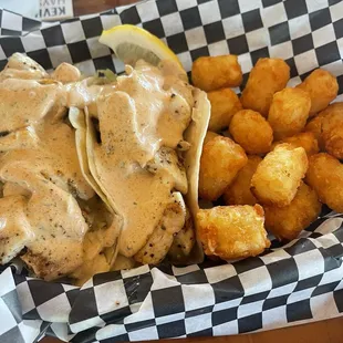 Fresh catch tacos and tots! So much fish had to eat it with a fork!