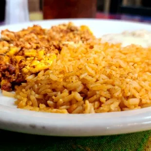 Huevos con chorizo, rice, and beans.