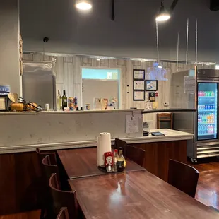 a dining area with a table and chairs