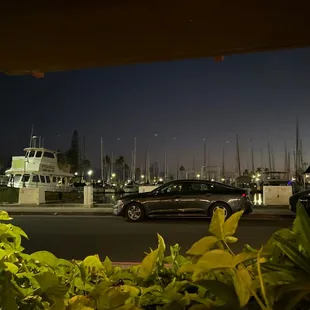 a car parked in front of a boat