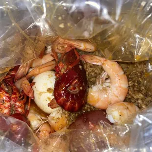 shrimp and crab in a plastic bag