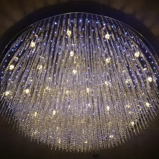 a circular chandelier with lights