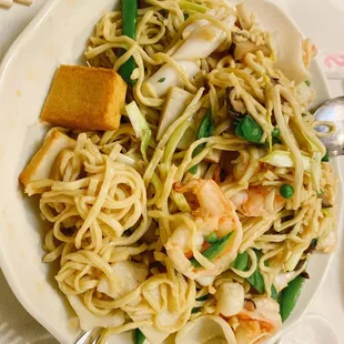 a plate of noodles and tofu