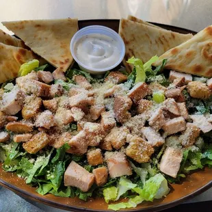 Too many croutons, not enough lettuce and chicken (which was dry). Dressing is creamy, not anchovy based. Looked better than it tasted.