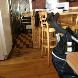 Printer on table. Kitchen messy.