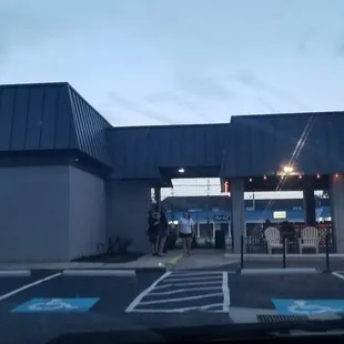 Patio area with picnic benches to the right.