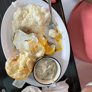 Eggs, biscuit and grits.