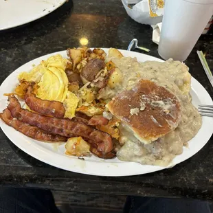 Eggs bacon taters with biscuits gravy