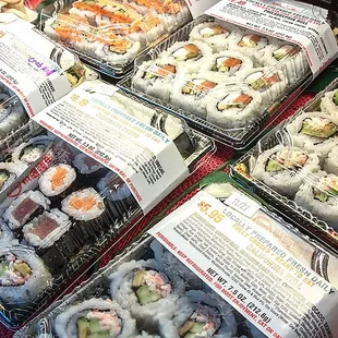 a display of sushi rolls