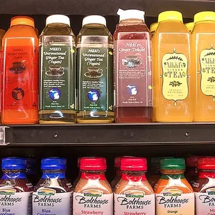 a variety of juices on a shelf