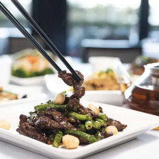 Wok-fired steak cubes &amp; macadamia nuts in black pepper sauce.