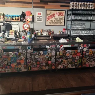 fridge with lots brewery stickers