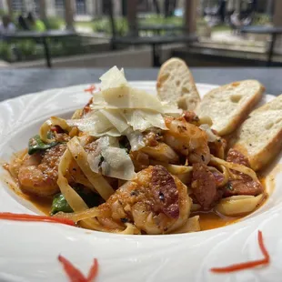 Special: Jambalaya Pasta. Linguine noodles tossed with home made marinara, bell peppers, spinach, spicy sausage, shrimp topped with parmesan