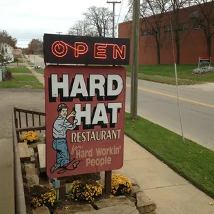 a sign for a hard hat restaurant