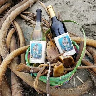 two bottles of wine in a basket