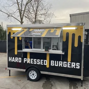 a black and yellow food truck
