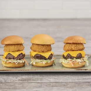 three burgers on a tray