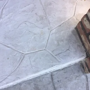 Mismatched colors, cracking in repaired surface, finger-indented designs where stamping mistakes were covered.