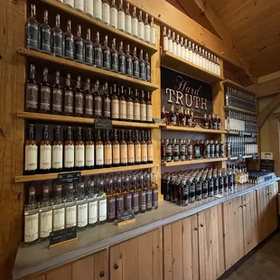 a shelf full of liquor bottles