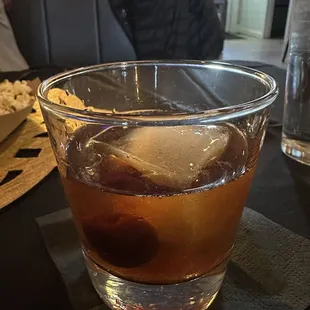 a drink in a glass on a table