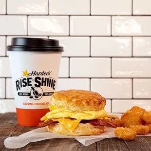 a breakfast sandwich and a cup of coffee