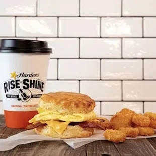 a breakfast sandwich and a cup of coffee