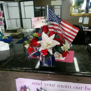 She ran out of American Flags bur she was so nice she especially went out to purchase one and have it put in the flower basket!