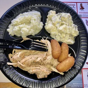 Pulled pork plate special with coleslaw, potato salad, and hush puppies