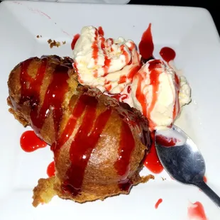Deep fried twinkie with strawberry drizzle and homemade vanilla ice cream