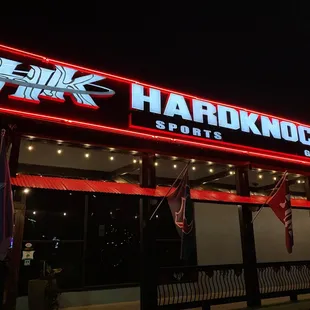 a neon sign for hardknocks