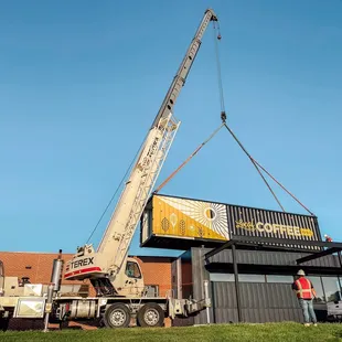 a crane lifting a container