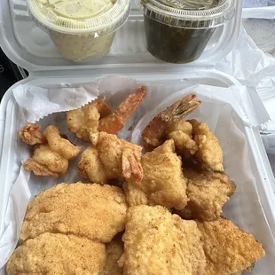 Catfish and shrimp platter with potato salad and collard greens