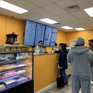 people standing in line at the counter