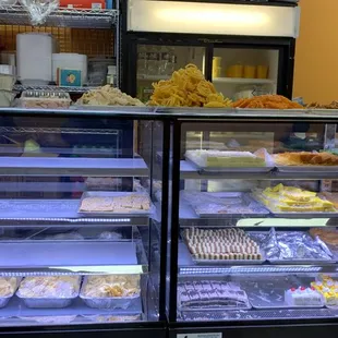a display case with a variety of pastries