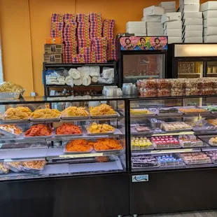 a display case with a variety of pastries