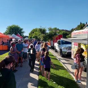 a crowd of people standing in line